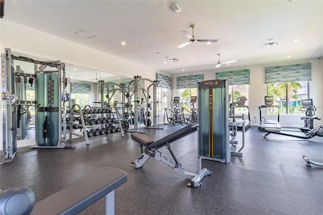 a living room with lots of furniture and a chandelier