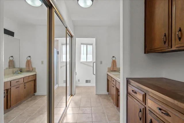 a kitchen with a refrigerator and a sink