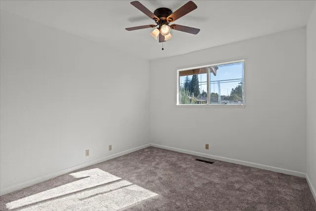 a view of a big room with carpet