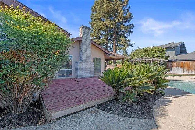 a view of a backyard with sitting area