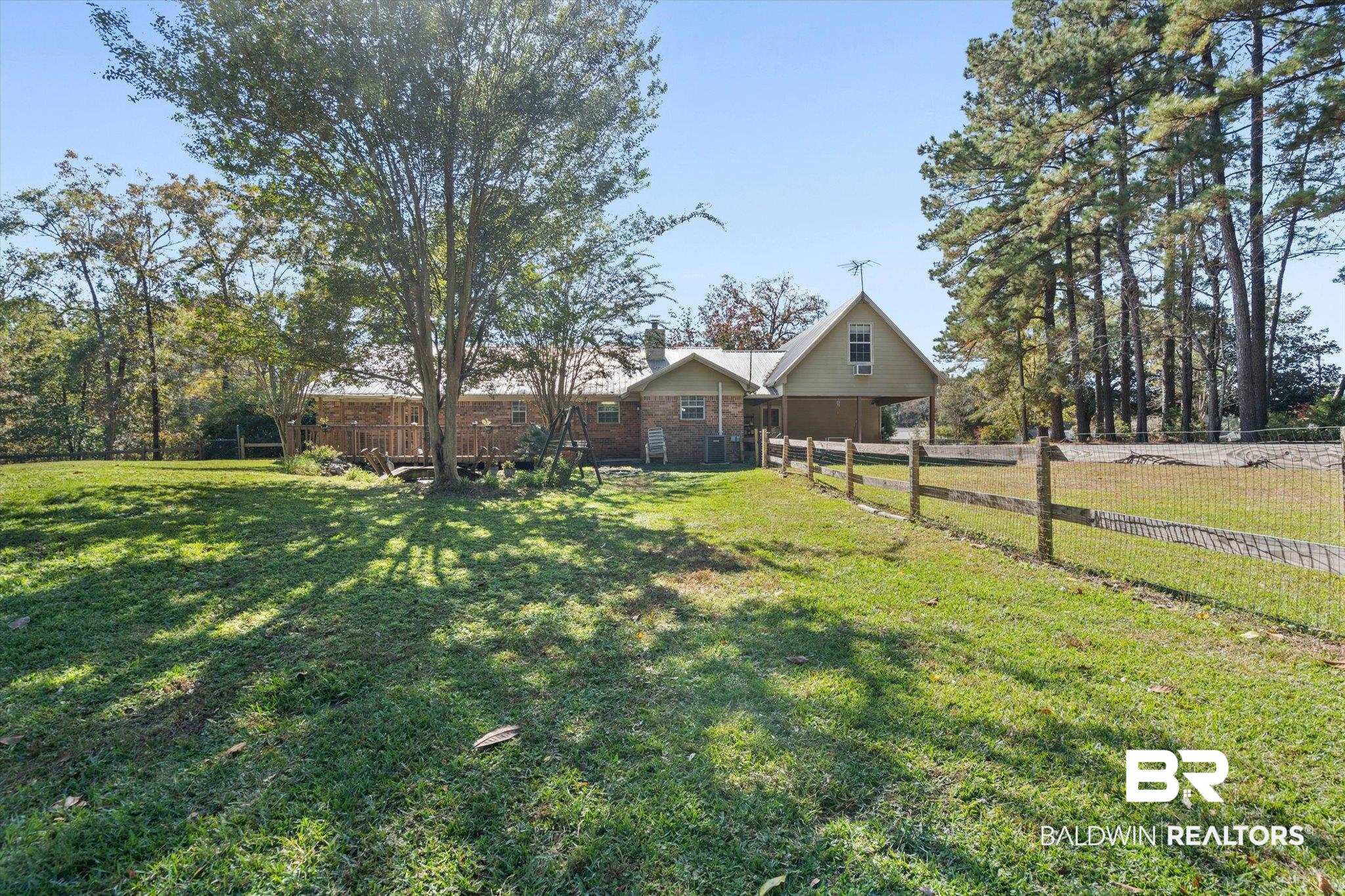 180 Creax Road Axis, AL 36505 - Photo 26 of 35 View of front of home featuring a chimney
