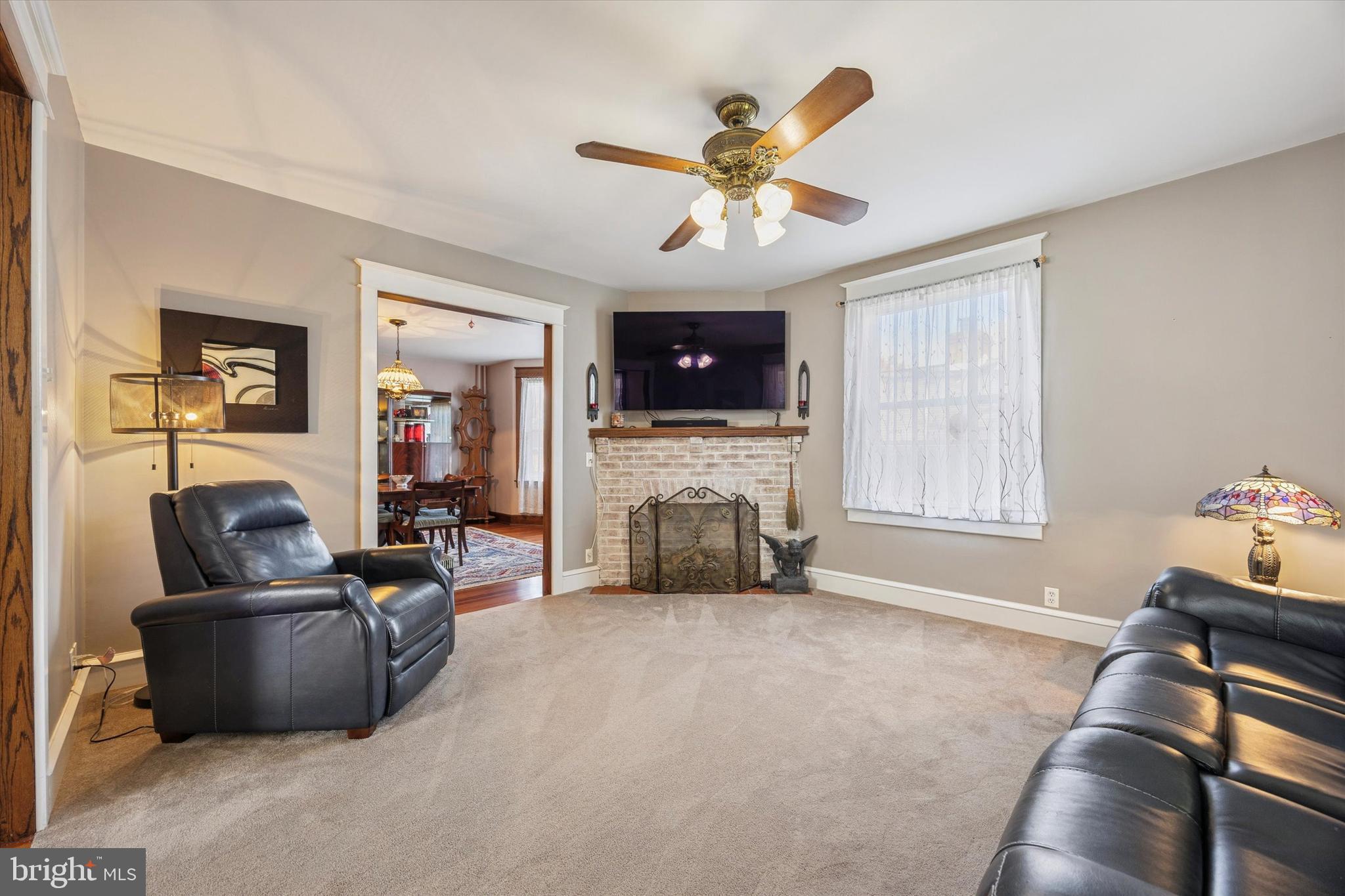 16 Chelten Road Havertown, PA 19083 - Photo 11 of 24 a living room with furniture fireplace and flat screen tv
