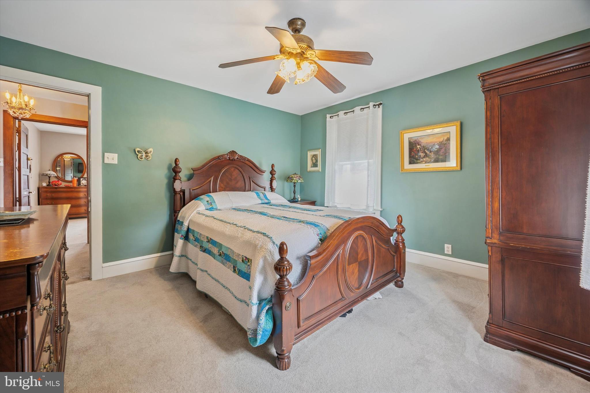 16 Chelten Road Havertown, PA 19083 - Photo 13 of 24 a bedroom with a bed and a chandelier