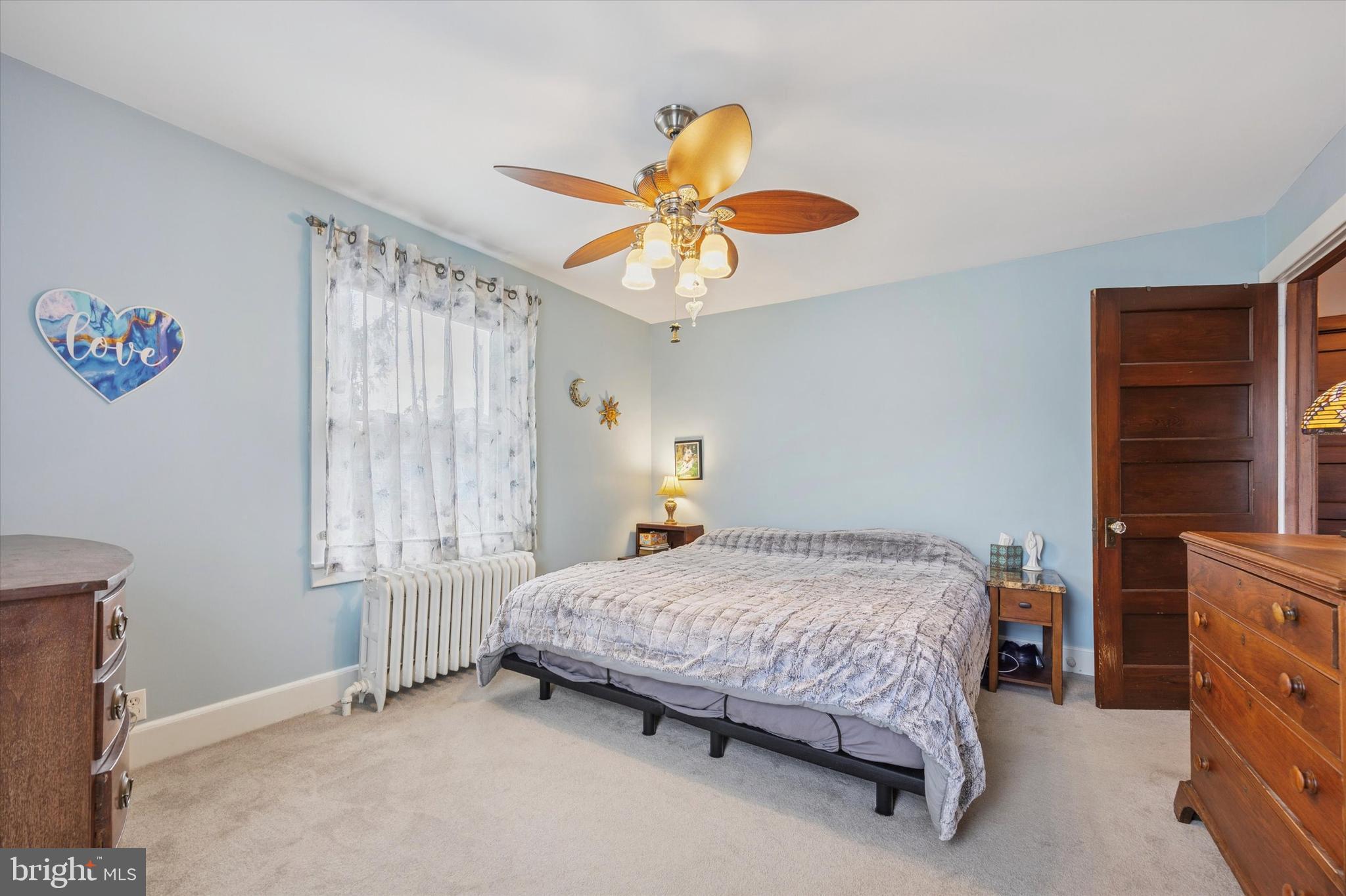 16 Chelten Road Havertown, PA 19083 - Photo 14 of 24 a bedroom with a bed and a chandelier