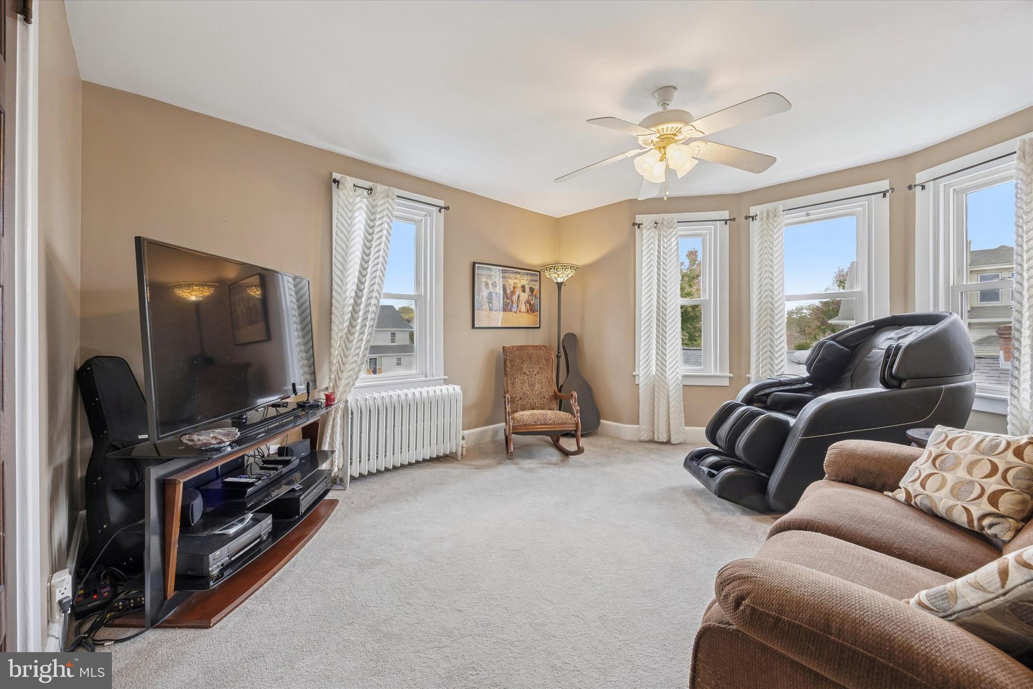 16 Chelten Road Havertown, PA 19083 - Photo 16 of 24 a living room with furniture and a flat screen tv