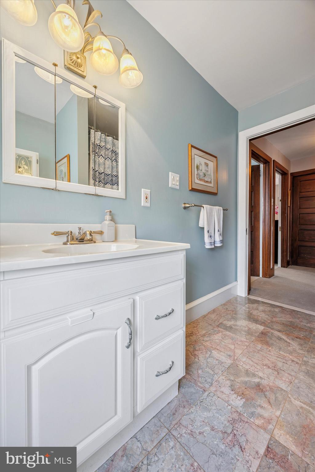 16 Chelten Road Havertown, PA 19083 - Photo 18 of 24 a bathroom with a sink vanity and mirror