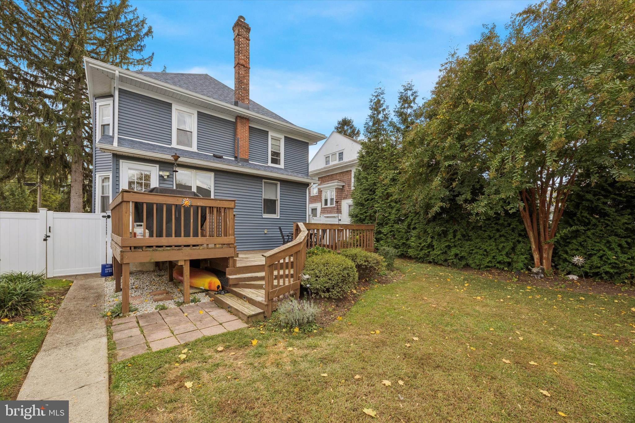 16 Chelten Road Havertown, PA 19083 - Photo 23 of 24 a backyard of a house with table and chairs
