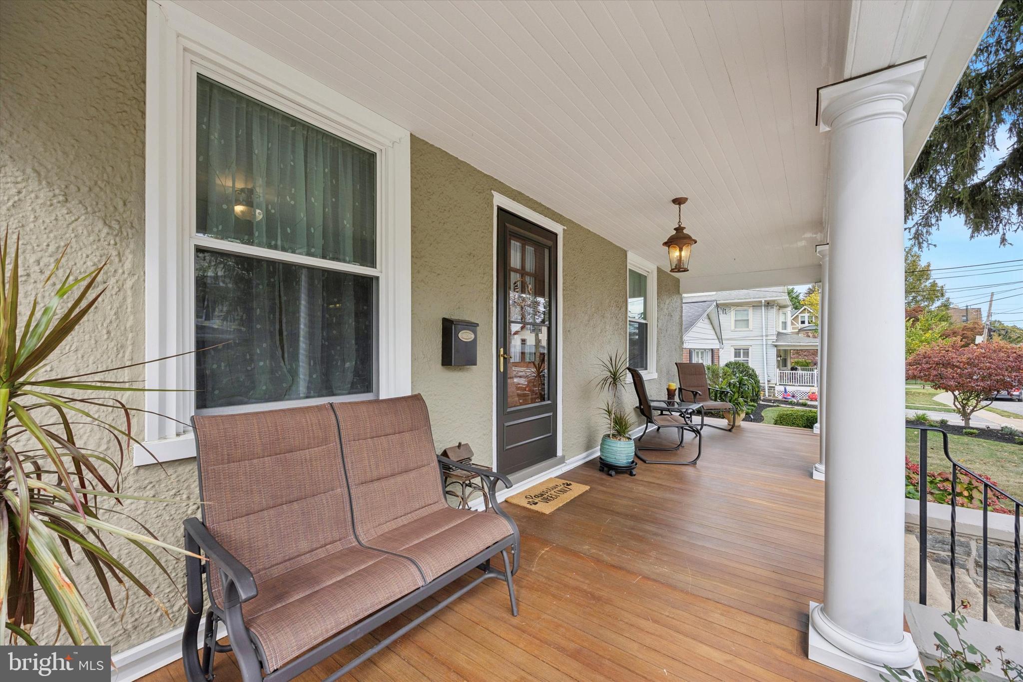 16 Chelten Road Havertown, PA 19083 - Photo 3 of 24 a living room with furniture floor to ceiling window and wooden floor