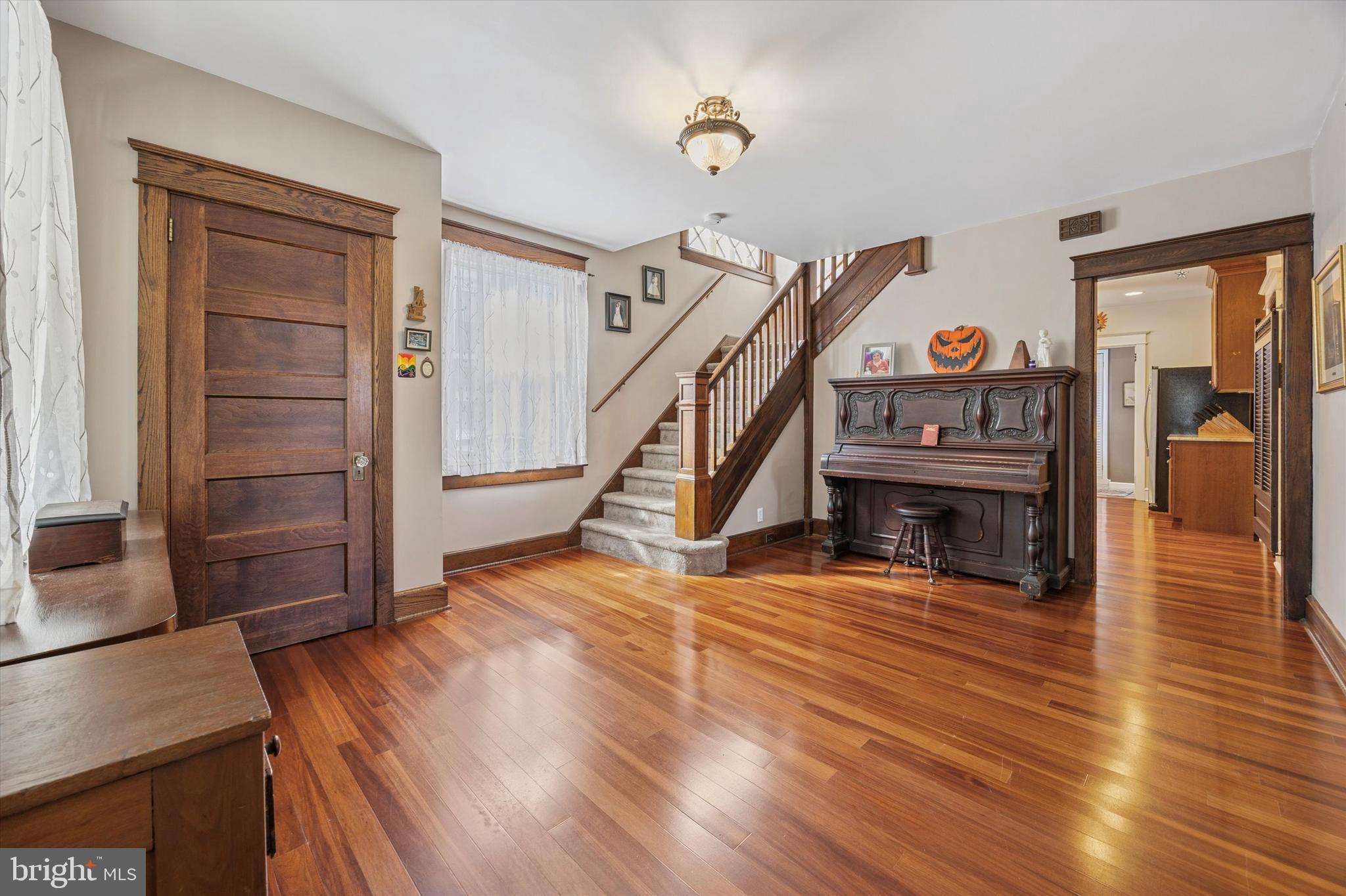 16 Chelten Road Havertown, PA 19083 - Photo 4 of 24 a view of a livingroom with wooden floor and staircase