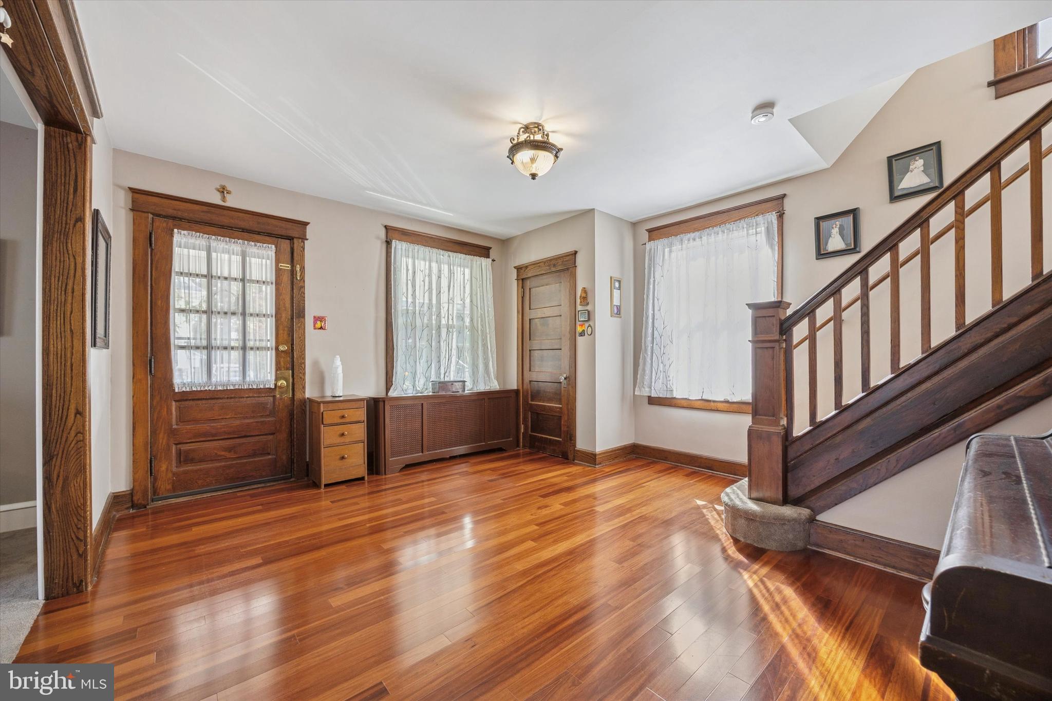 16 Chelten Road Havertown, PA 19083 - Photo 5 of 24 a view of an empty room with wooden floor and a window