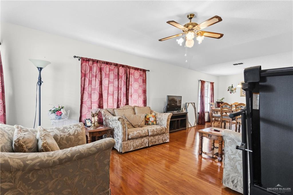 1909 Tyler Street Mission, TX 78572 - Photo 11 of 17 a living room with furniture and a large window