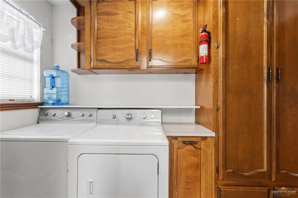 1909 Tyler Street Mission, TX 78572 - Photo 12 of 17 a utility room with dryer and washer