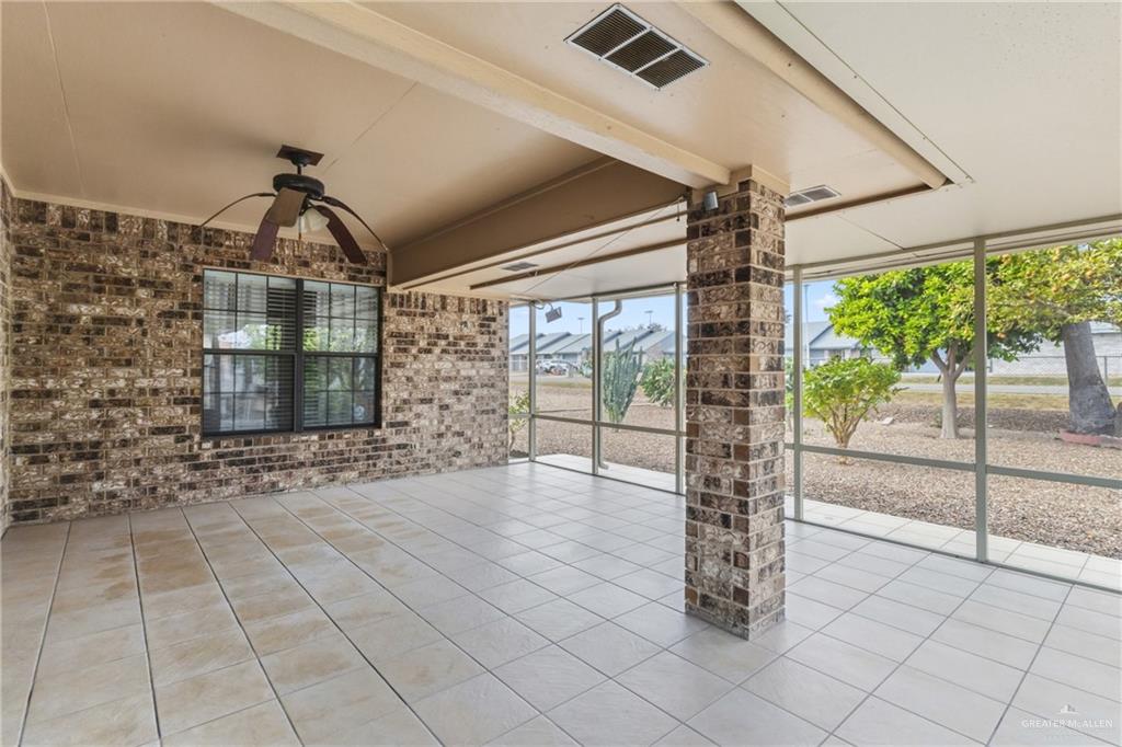 1909 Tyler Street Mission, TX 78572 - Photo 4 of 17 a view of empty room with wooden floor and fan