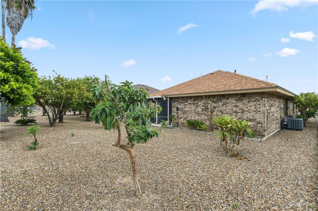 1909 Tyler Street Mission, TX 78572 - Photo 6 of 17 a view of a house with a yard and porch
