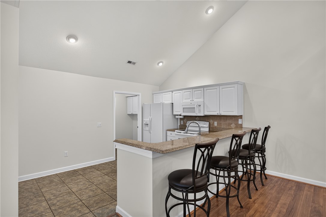 134 Life Style Lane Anderson, SC 29621 - Photo 4 of 44 Granite counters and stainless appliances define this contemporary kitchen with soaring vaulted ceilings.