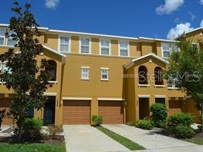 7339 Black Walnut Way Lakewood Ranch, FL 34202 - Photo 1 of 27 a front view of a house with a garden