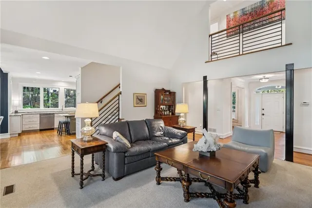 a balcony with furniture and a potted plant