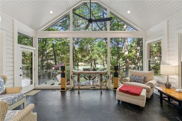 a view of living room with furniture and a fireplace