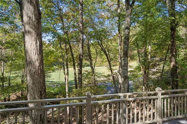 a view of a deck with furniture and wooden floor