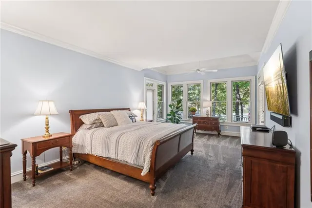 a bathroom with double vanity sinks a large mirror and a shower