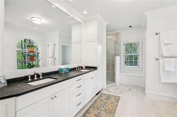 a bathroom with a toilet a sink and a mirror
