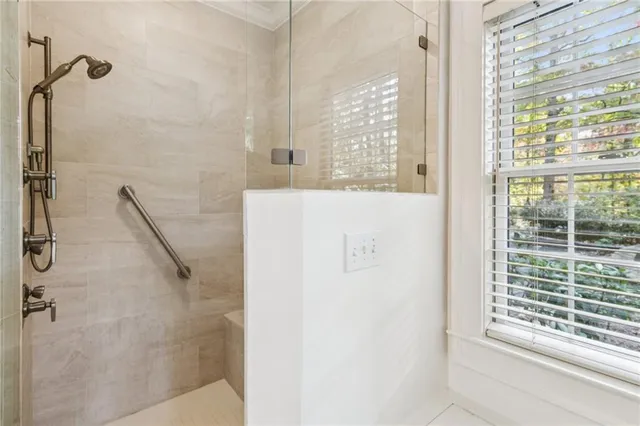a spacious bathroom with a granite countertop sink and a mirror