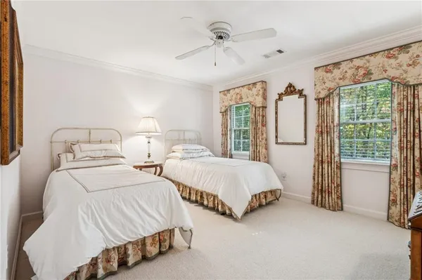 a living room with furniture a chandelier and a fireplace