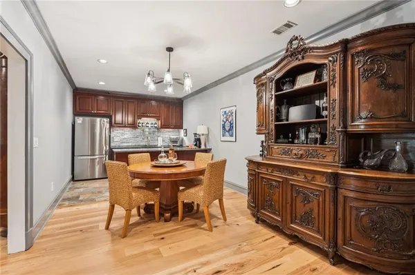 a bathroom with a granite countertop sink and a toilet