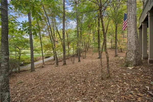 a view of a lush green hillside and a building in the background