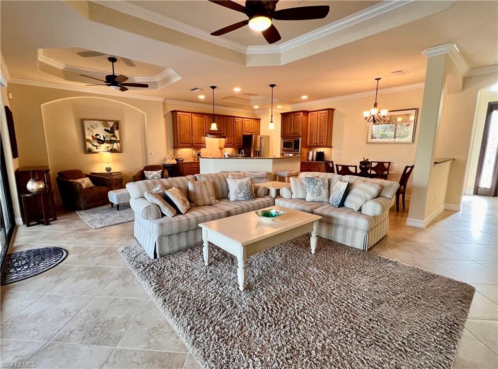 9419 Piacere Way Naples, FL 34113 - Photo 2 of 19 a living room with furniture and a rug