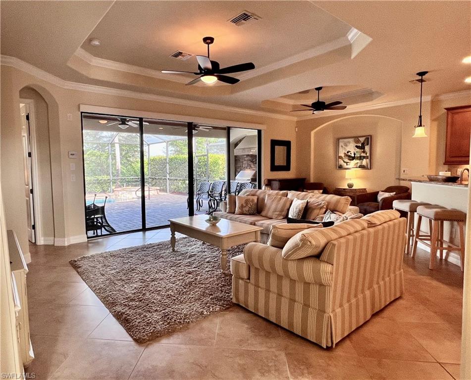 9419 Piacere Way Naples, FL 34113 - Photo 6 of 19 a living room with furniture and a rug