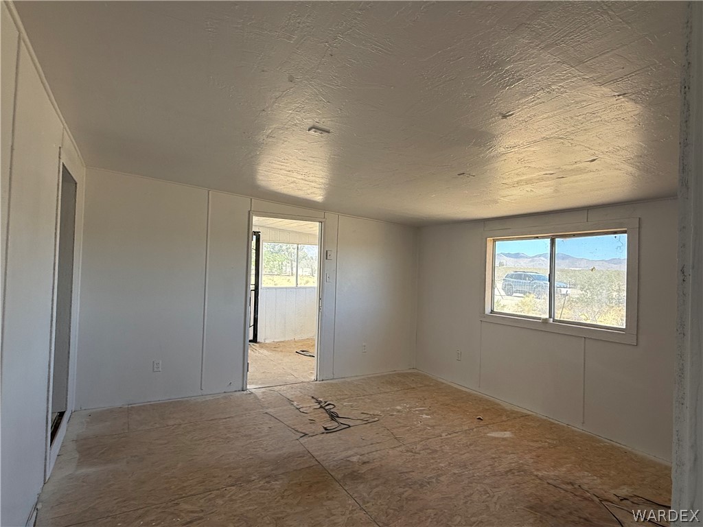 8051 7th Street Dolan Springs, AZ 86441 - Photo 11 of 65 an empty room with windows