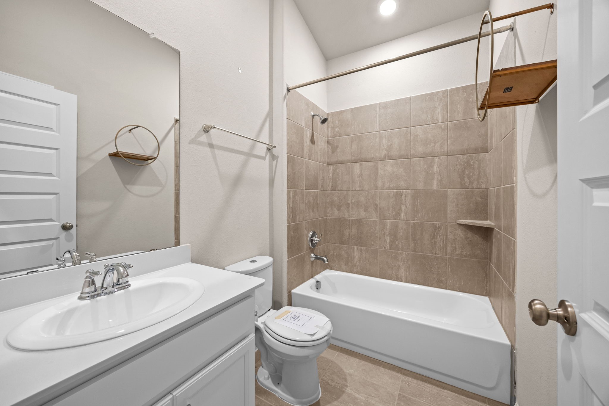 2406 Temple Crag Drive Rosharon, TX 77583 - Photo 19 of 26 This pretty secondary bathroom is tucked conveniently between two bedrooms.