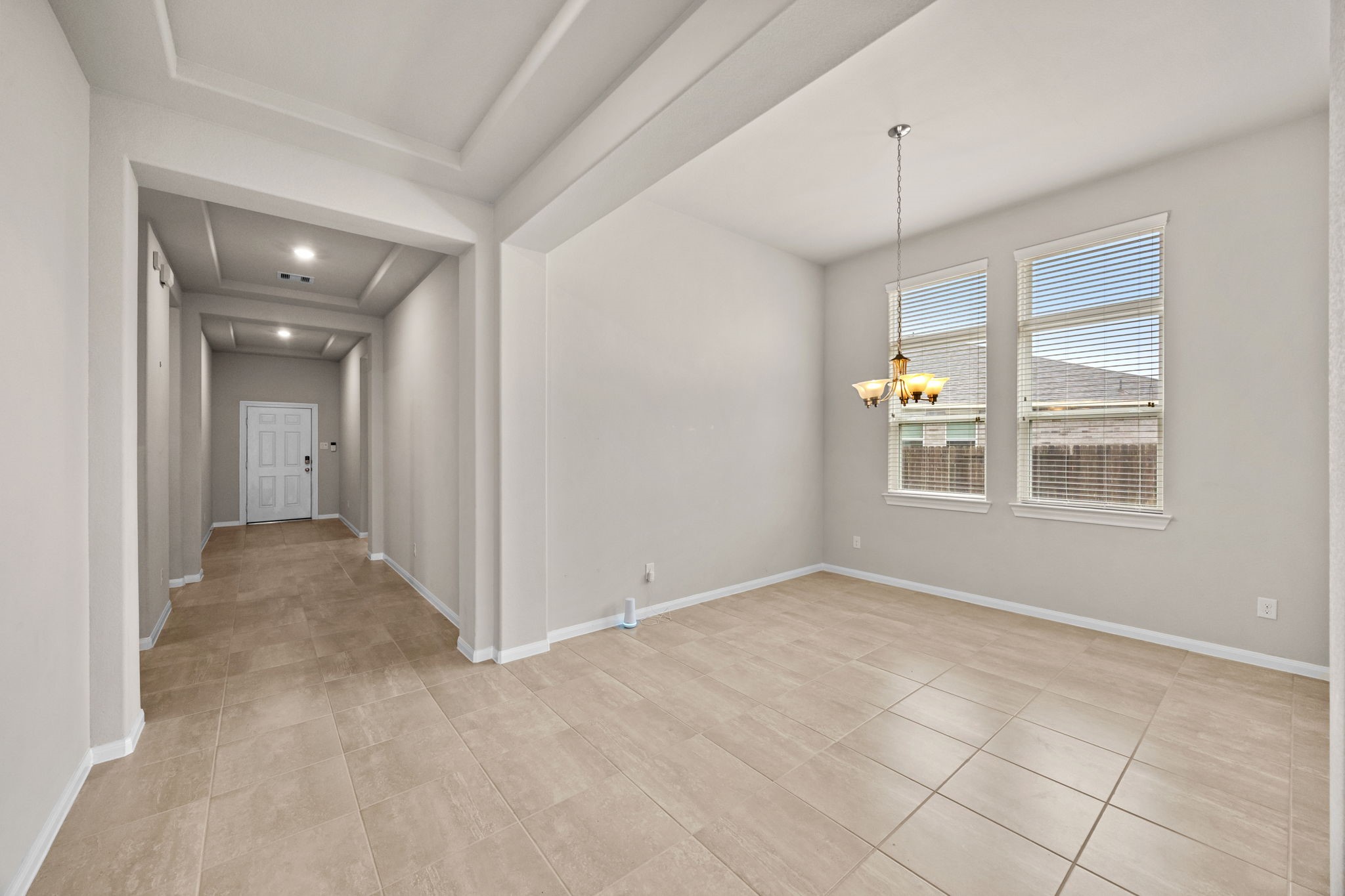 2406 Temple Crag Drive Rosharon, TX 77583 - Photo 4 of 26 A look back down the main entry hallway to the front door with the formal dining room on the right.
