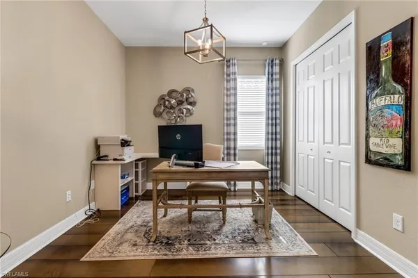 a living room with furniture a rug and a window