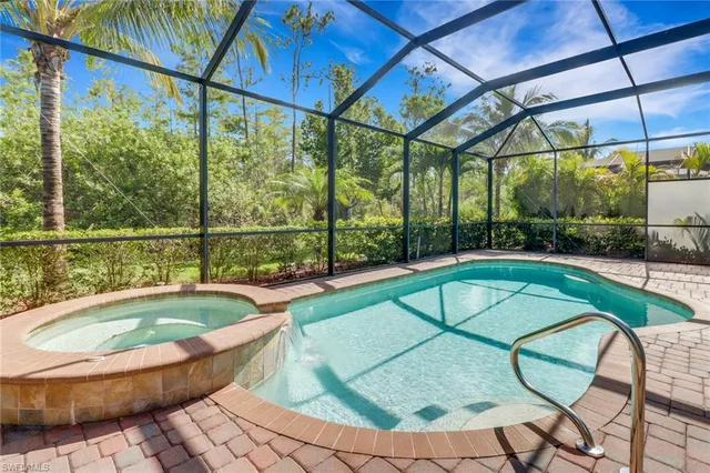 a view of a swimming pool with a patio