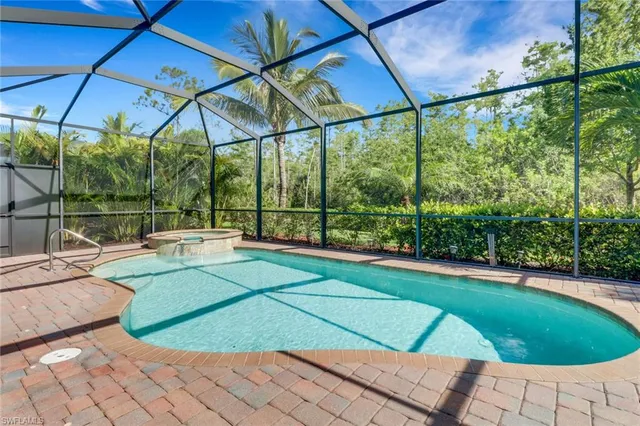 a view of a backyard with a small deck and a garden