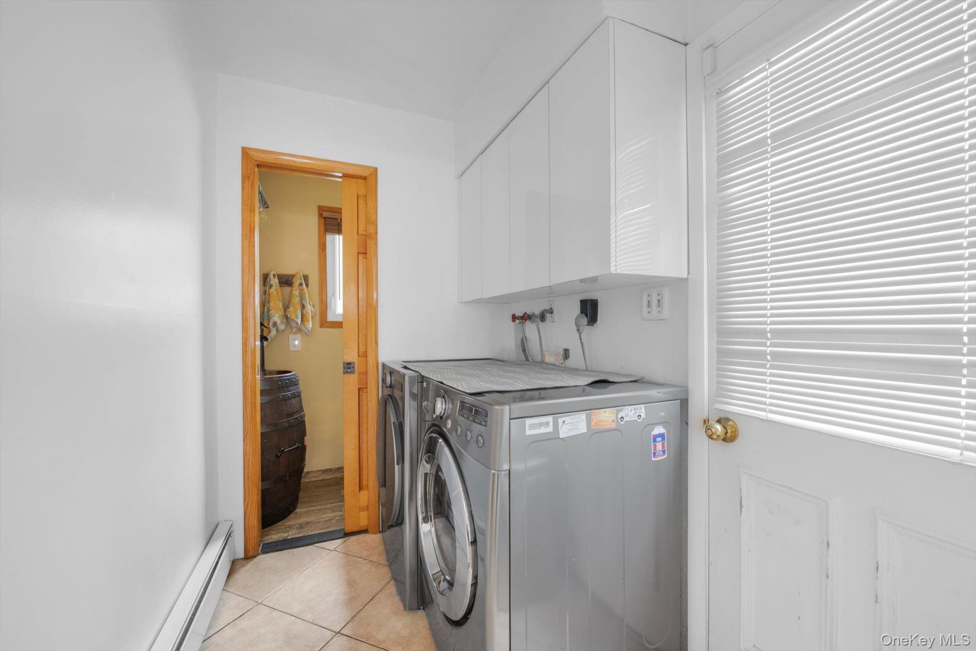713 Hungry Harbor Road Valley Stream, NY 11581 - Photo 12 of 25 a utility room with dryer and washer