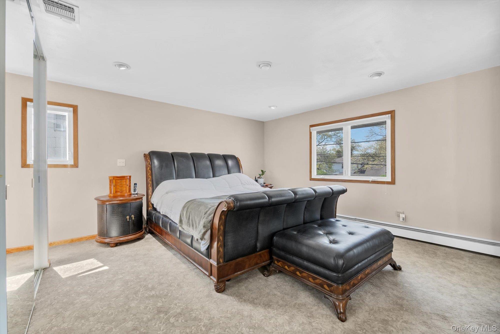 713 Hungry Harbor Road Valley Stream, NY 11581 - Photo 13 of 25 a bedroom with a bed and a window