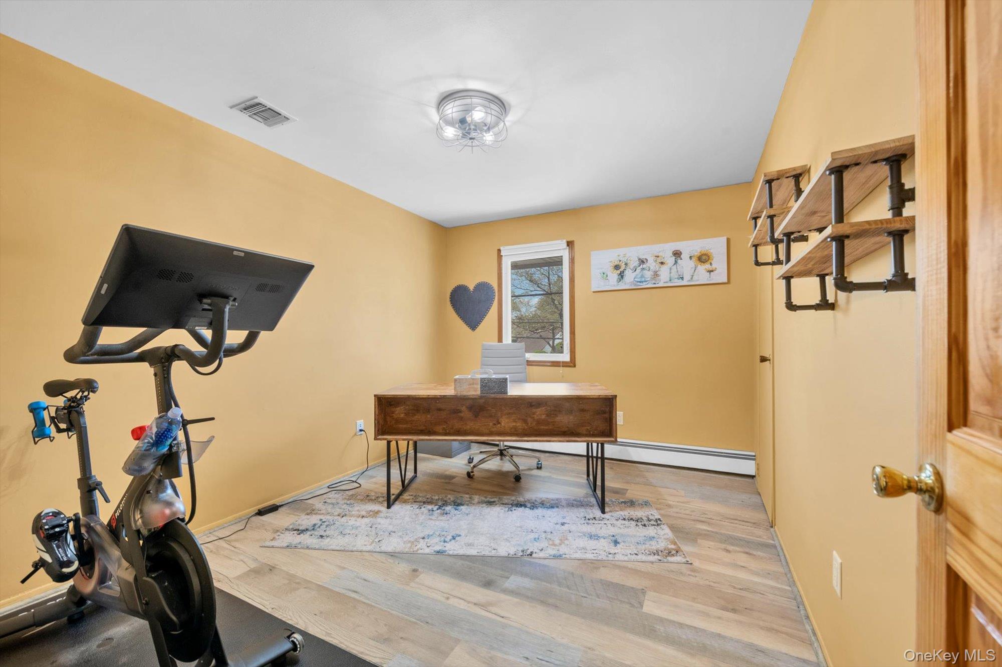 713 Hungry Harbor Road Valley Stream, NY 11581 - Photo 17 of 25 a view of a livingroom with furniture and a table