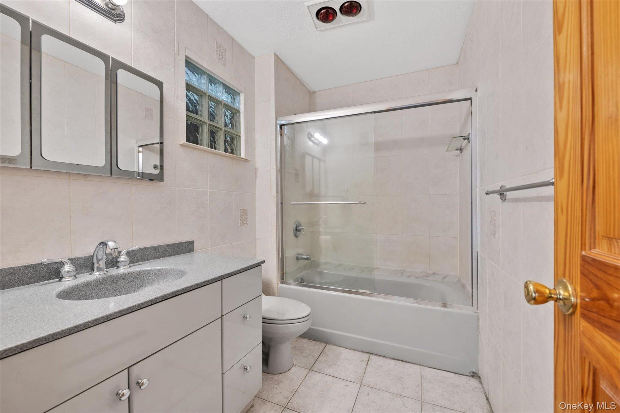 713 Hungry Harbor Road Valley Stream, NY 11581 - Photo 18 of 25 a bathroom with a sink a toilet and shower