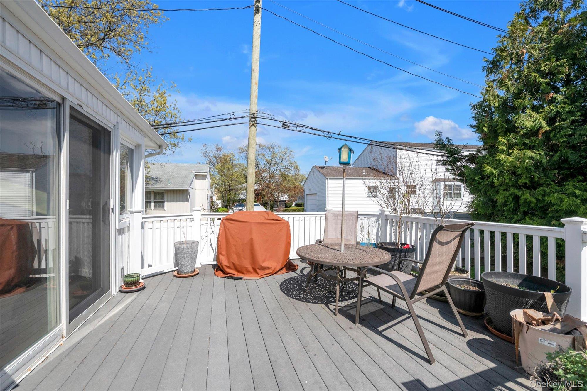 713 Hungry Harbor Road Valley Stream, NY 11581 - Photo 20 of 25 a view of balcony with furniture and wooden deck