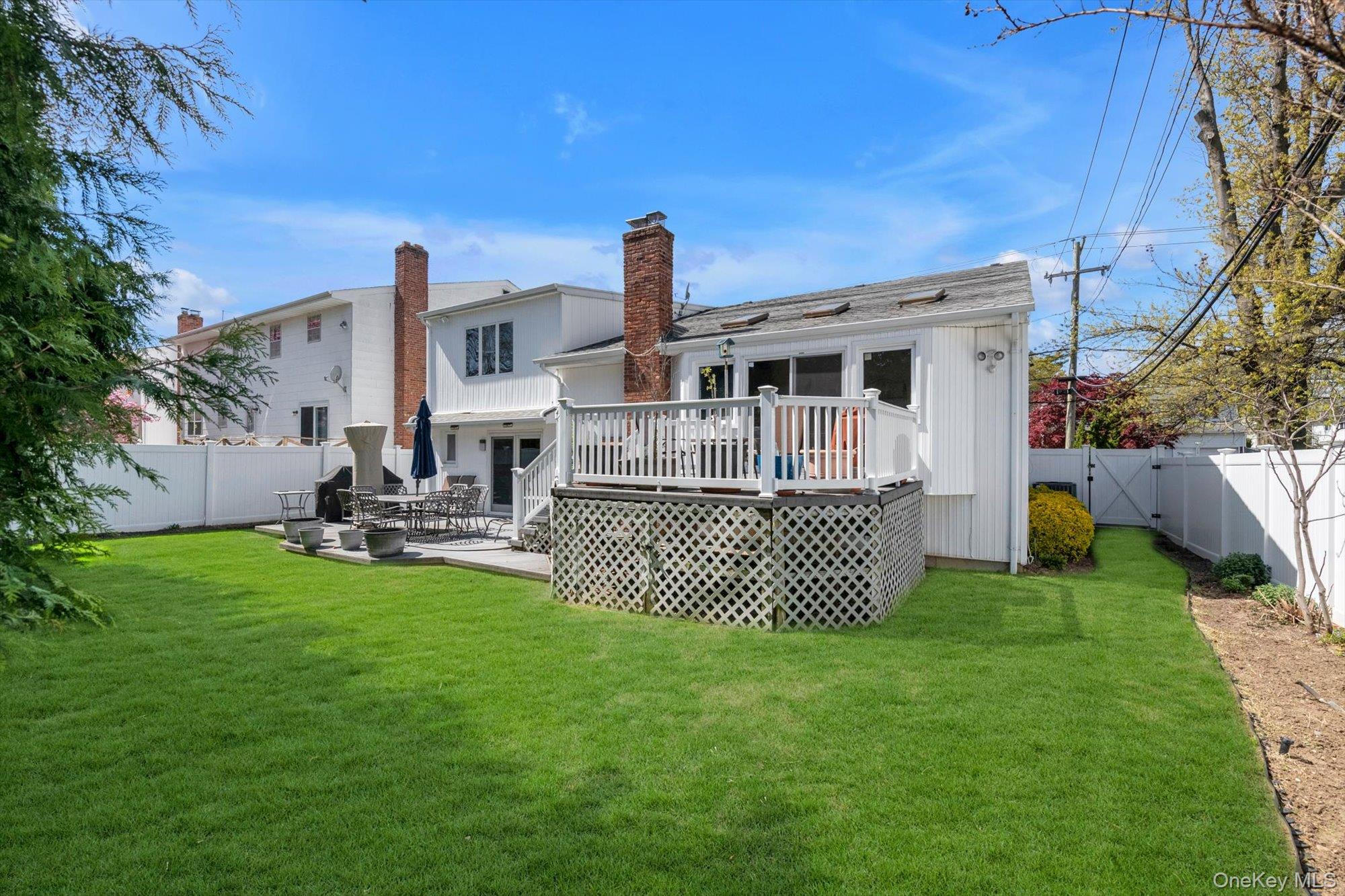 713 Hungry Harbor Road Valley Stream, NY 11581 - Photo 22 of 25 a front view of a house with a garden