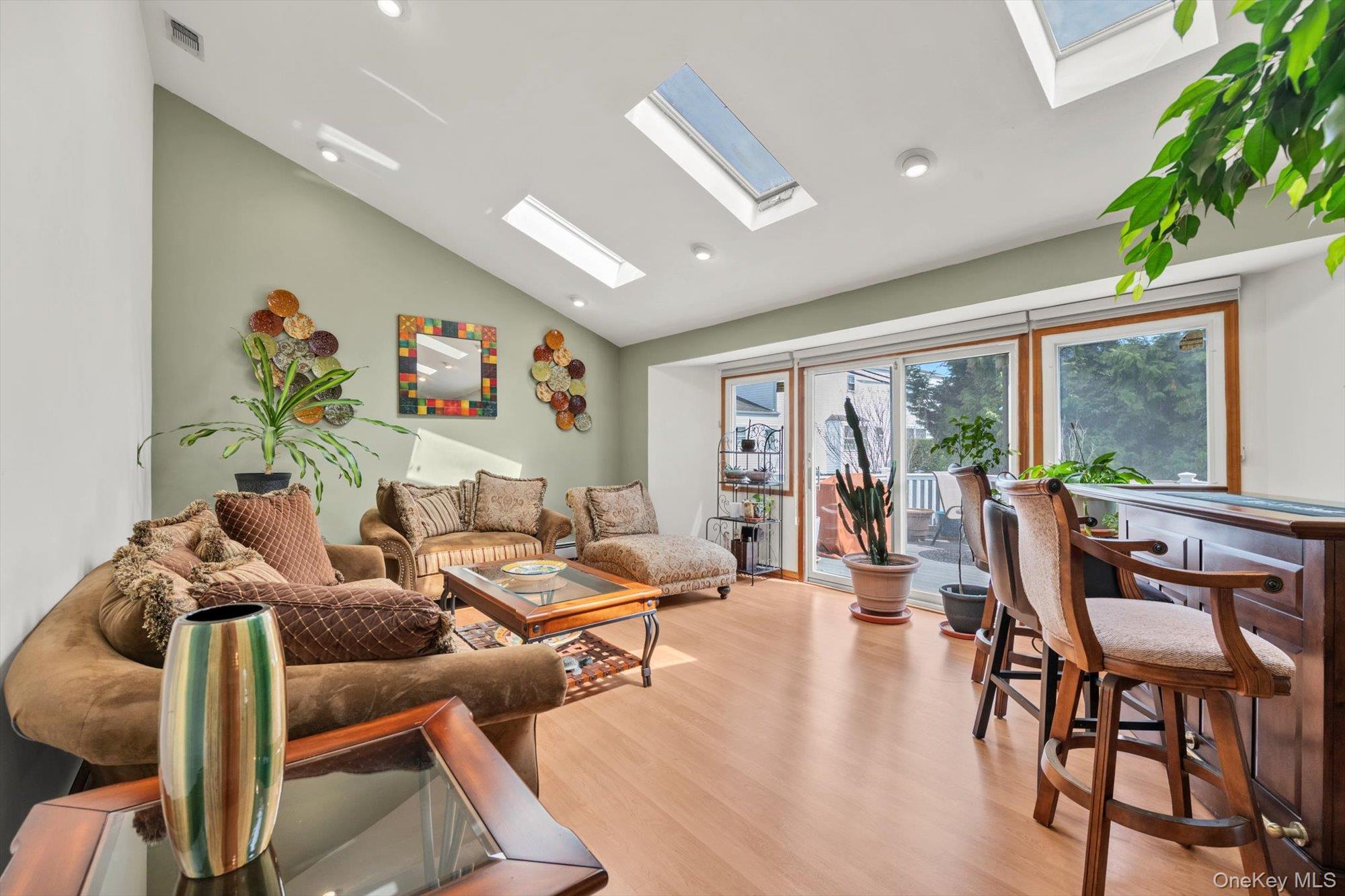 713 Hungry Harbor Road Valley Stream, NY 11581 - Photo 7 of 25 a living room with furniture and a large window