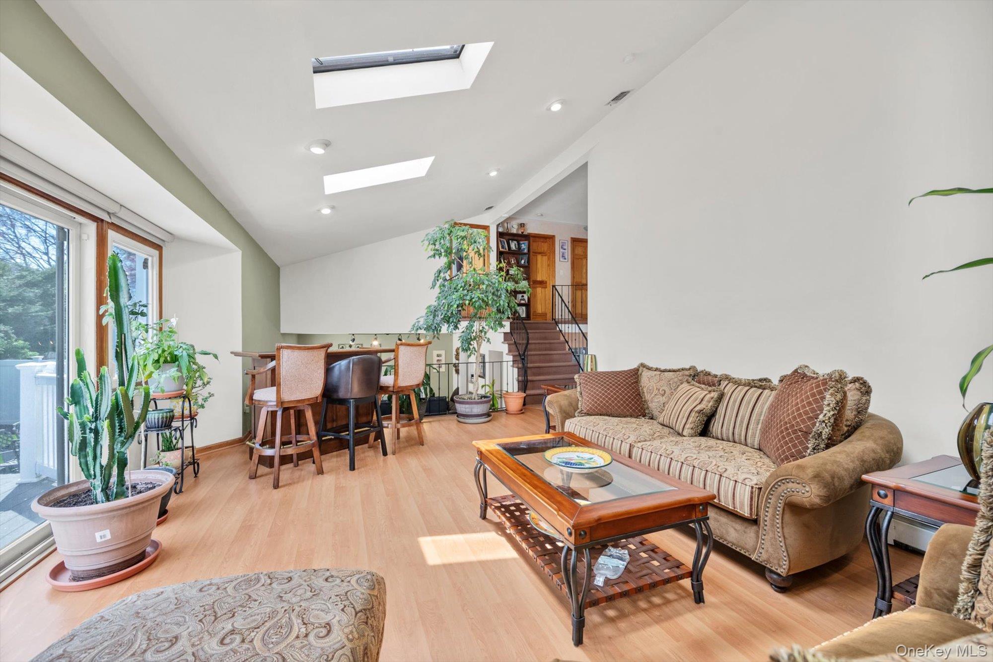 713 Hungry Harbor Road Valley Stream, NY 11581 - Photo 8 of 25 a living room with furniture and a potted plant