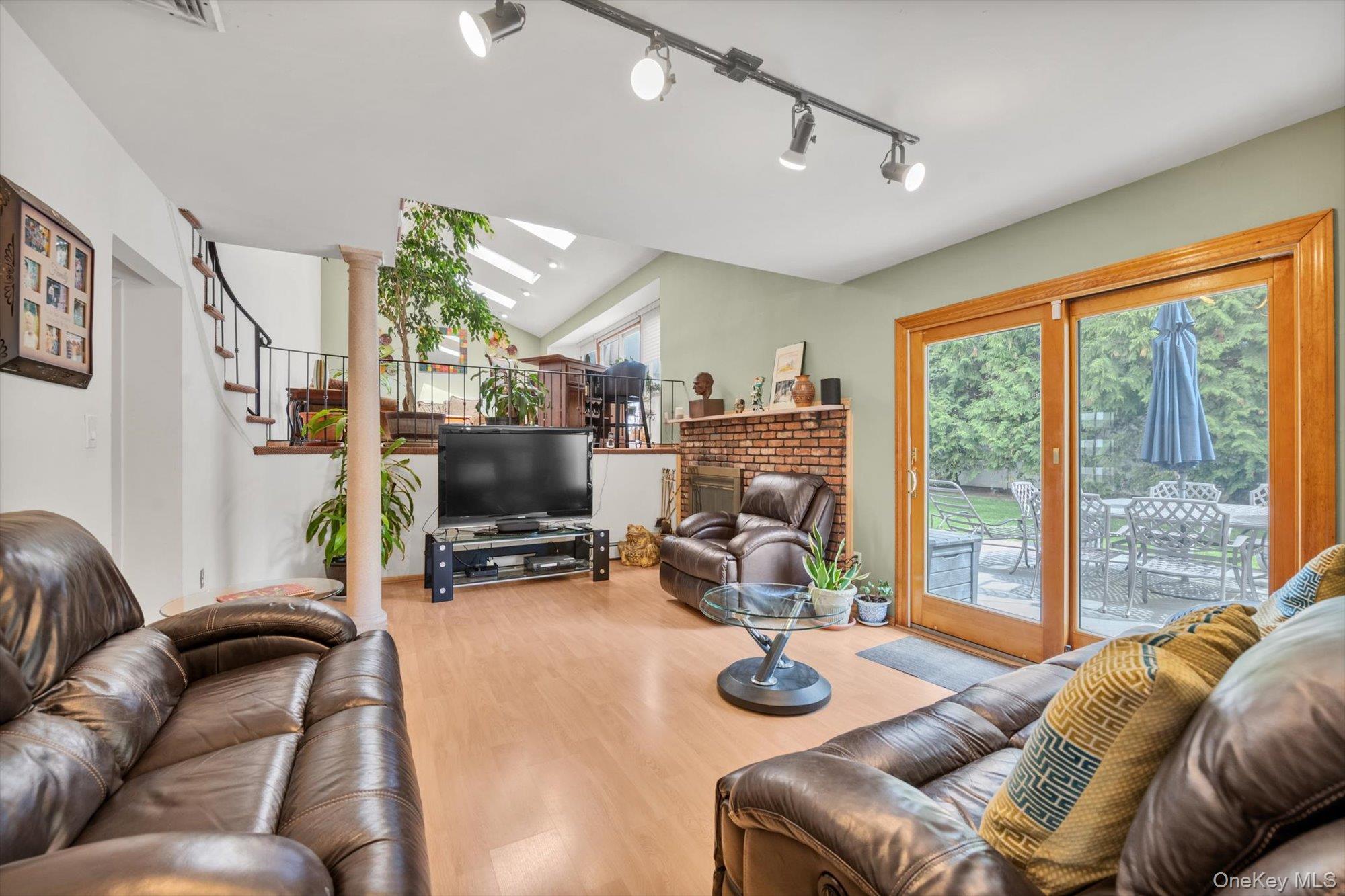 713 Hungry Harbor Road Valley Stream, NY 11581 - Photo 9 of 25 a living room with furniture and a flat screen tv