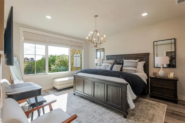 a bedroom with a bed and a couch