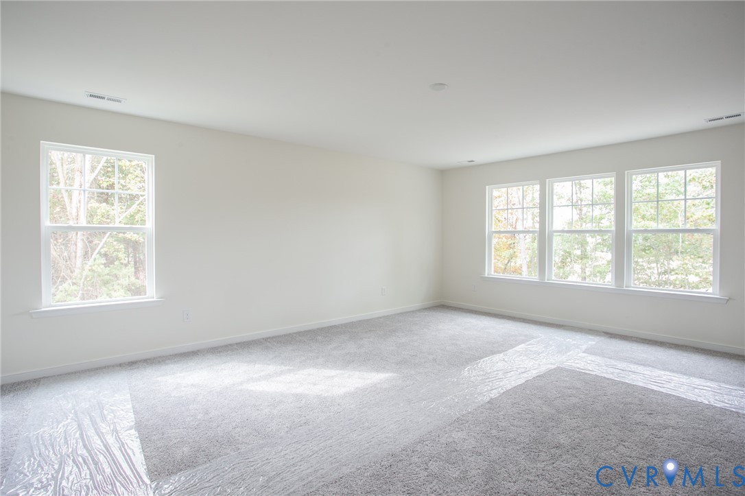 4830 Tuscany Road Moseley, VA 23120 - Photo 12 of 23 a view of an empty room with a window