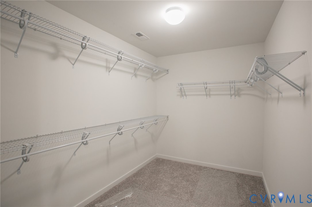 4830 Tuscany Road Moseley, VA 23120 - Photo 16 of 23 a view of a room with racks on the wall