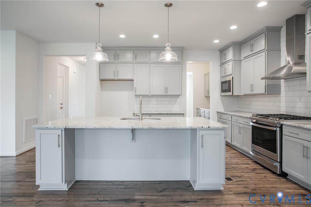 4830 Tuscany Road Moseley, VA 23120 - Photo 7 of 23 a large kitchen with stainless steel appliances lots of counter space sink and cabinets